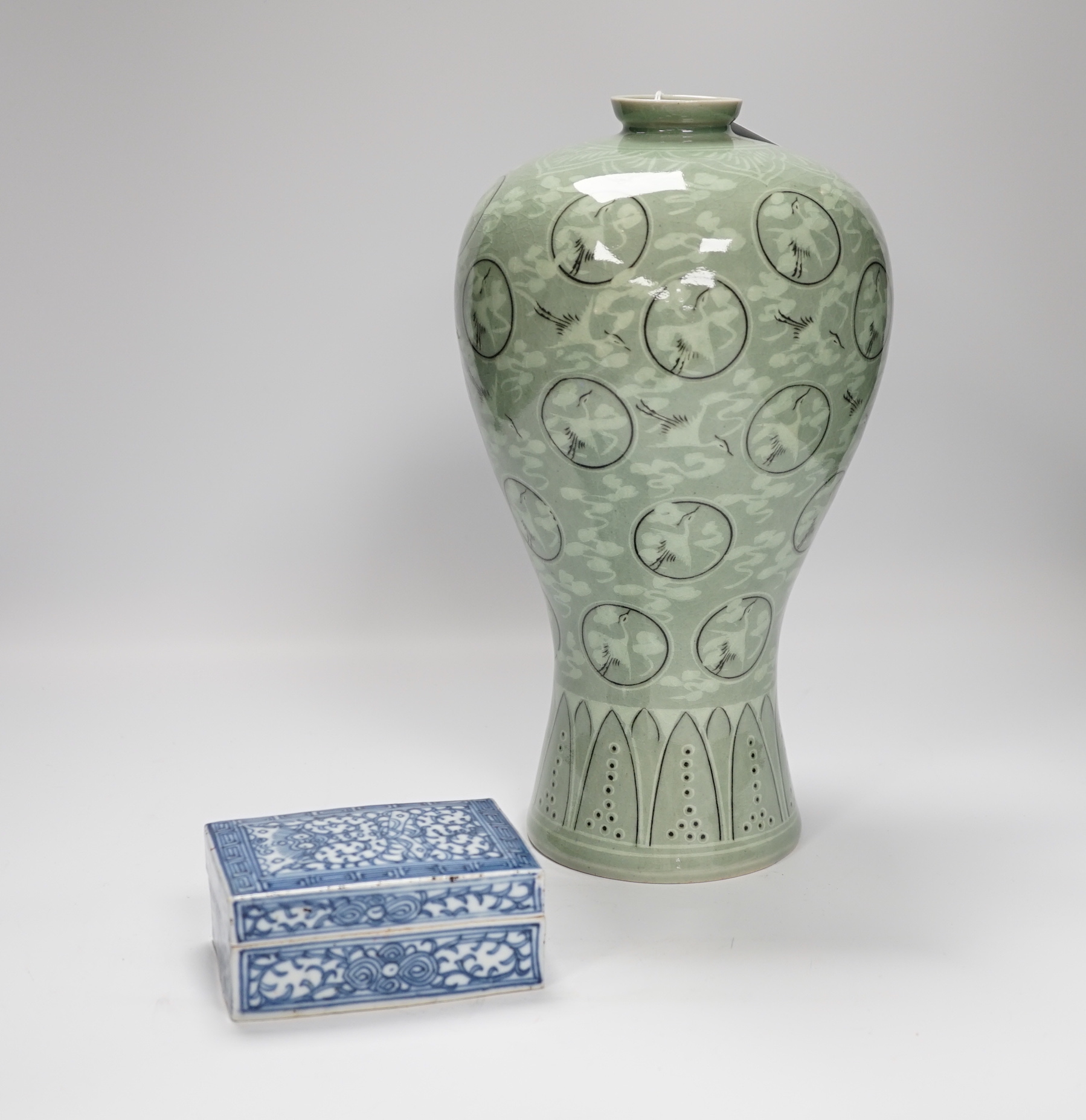 A Chinese blue and white seal paste box, and a Korean celadon vase decorated with cranes, 33cm high